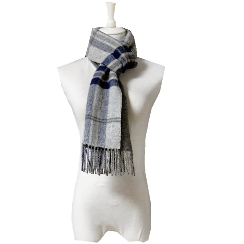A clean flat lay of the grey and navy wool plaid scarf, emphasizing the classic design and natural softness.