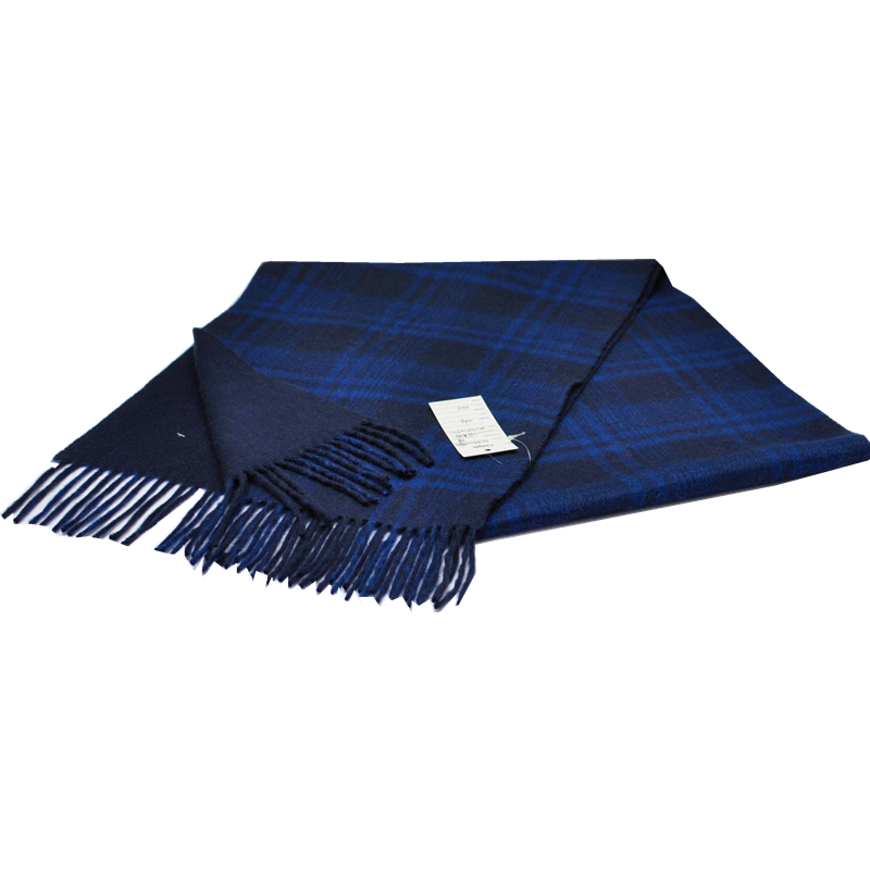 Macro shot of the solid navy cashmere scarf reverse layer showing glossy water wave ripple path