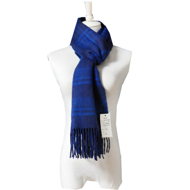 TH1963 oversized cashmere scarf neatly folded to display both plain and grid contrast textiles