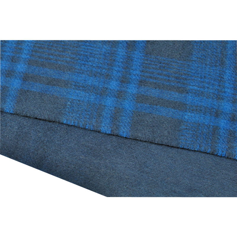 Detailed texture of the thick fluffy 206g pure cashmere fabric under natural showroom lighting