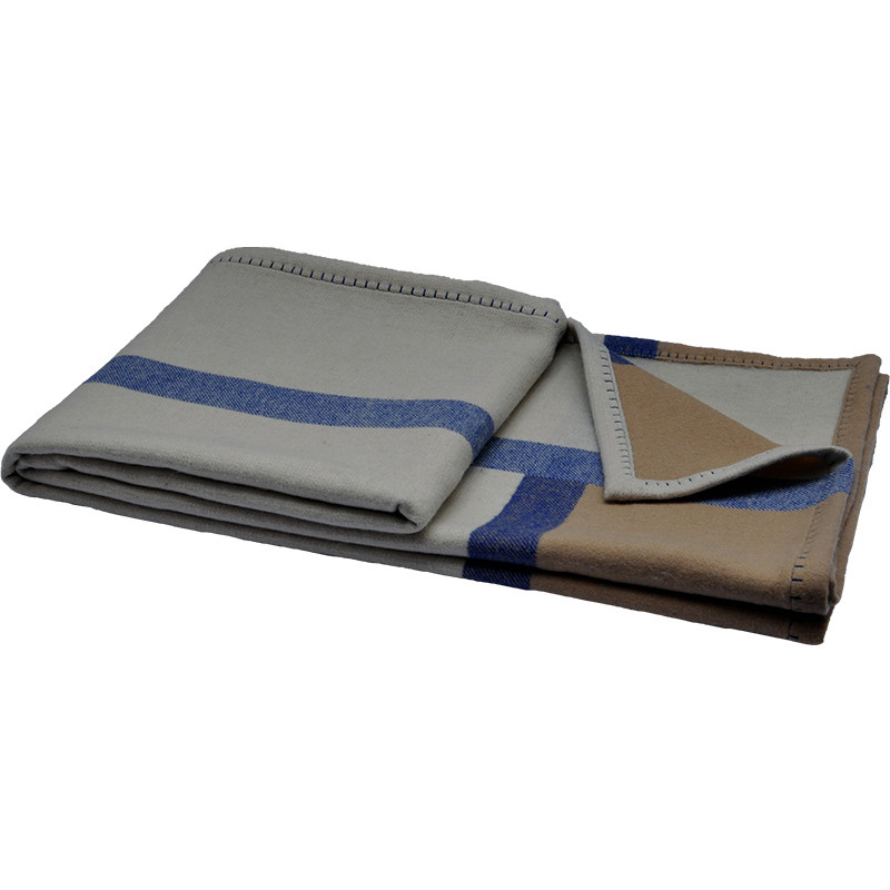 Folded Q0192-A 100% lambswool blanket in warm grey, camel and blue with four-sided contrast blanket-stitch edging.