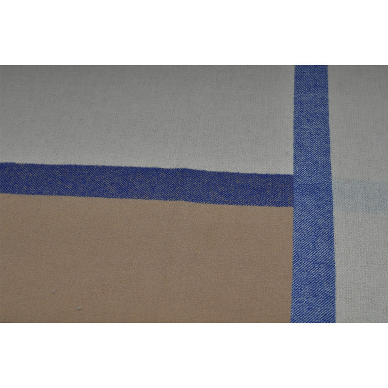 Detailed Q0192-A wool blanket color-block pattern where the warm-grey, camel and blue woven stripes intersect.