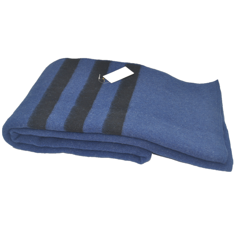tbh2001 blue wool blend blanket, folded angled view, three dark stripes and attached sample tag