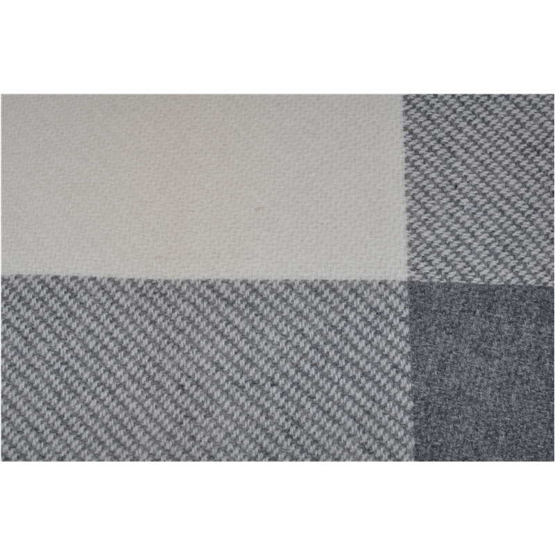 A close-up of the textile weave, showing the transition between solid cream and grey diagonal twill patterns.