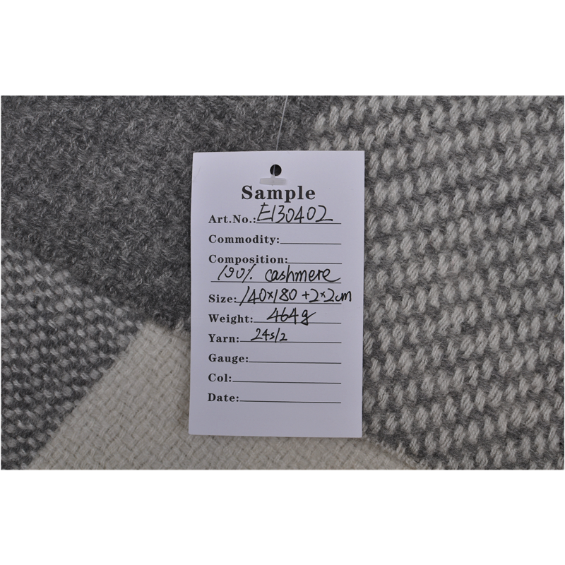 A photo of a Sample product tag indicating 100% cashmere composition, 140x180cm size, and a weight of 464g.