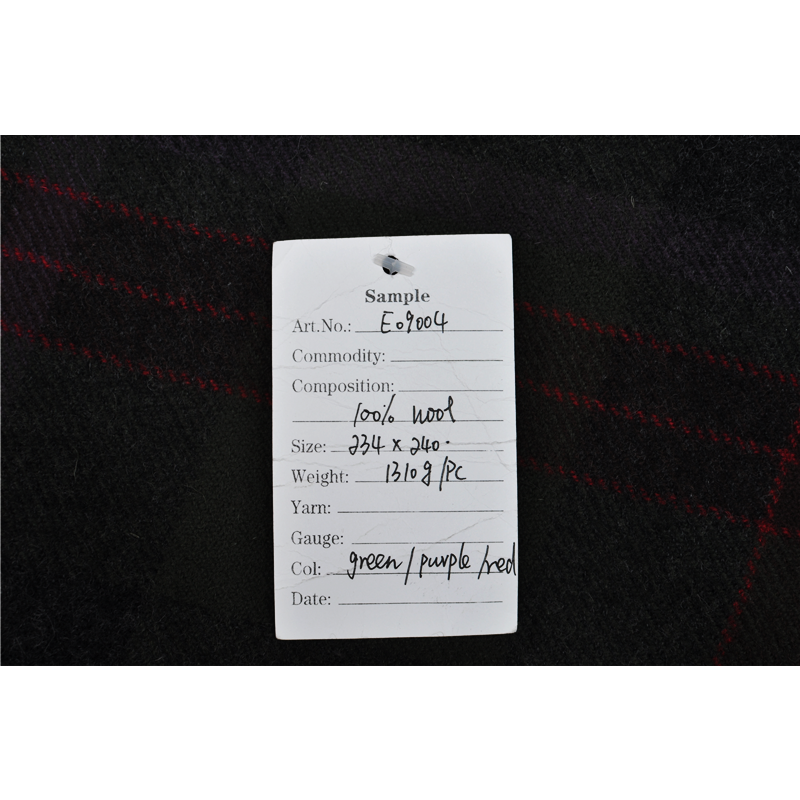 E09004 100% wool blanket with specification tag showing the 234 × 240 cm size and 1310 g weight