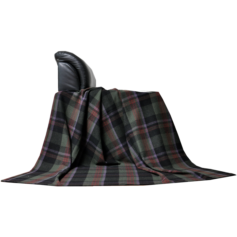 TBT1802 100% wool plaid throw arranged over a modern black chair to show its soft folds and generous coverage