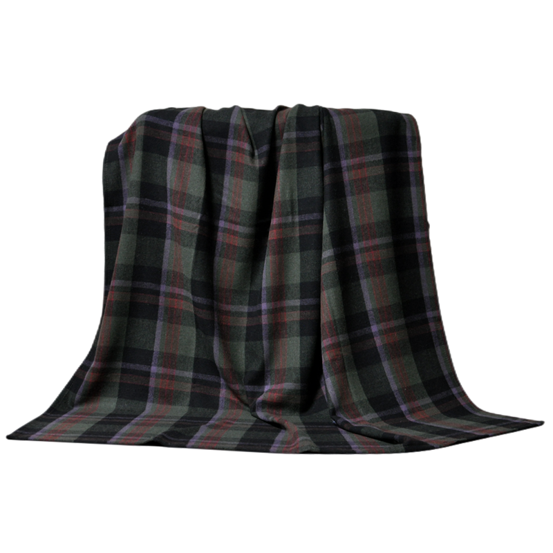 Fully draped TBT1802 tartan wool blanket showing the complete dark green, charcoal, purple and burgundy plaid design