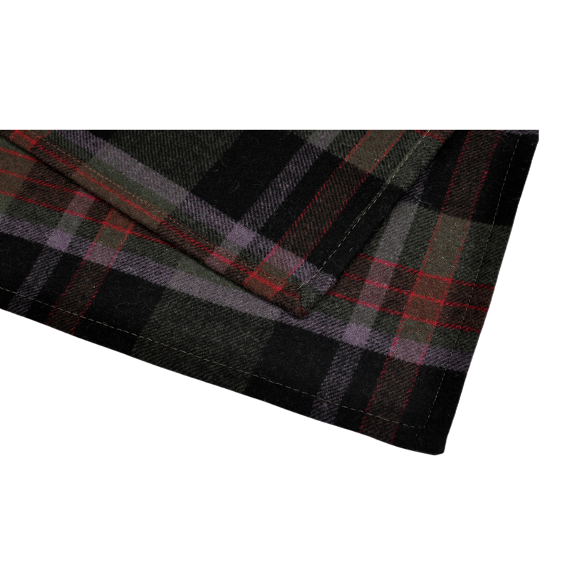 Close-up of TBT1802 wool blanket showing its neat four-sided folded edge, reinforced stitching and tartan pattern