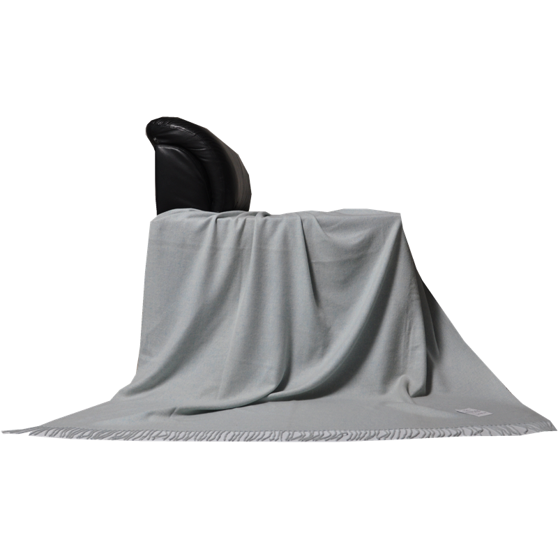 Draped mélange blue cashmere wool throw E1104 on a chair, full view
