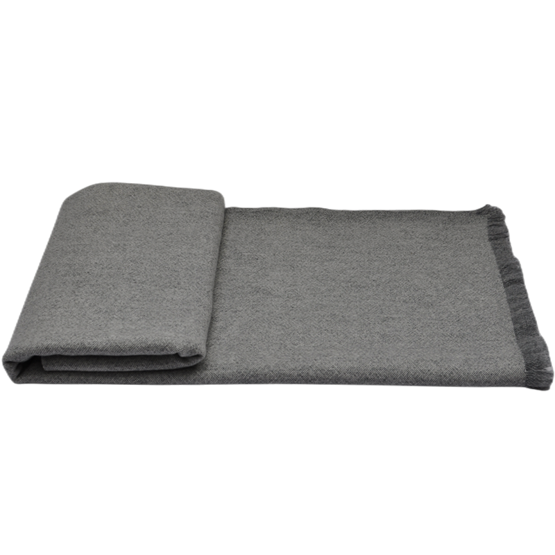 Front view of the lightweight TH2207 cashmere blanket folded over its full-length woven fabric.