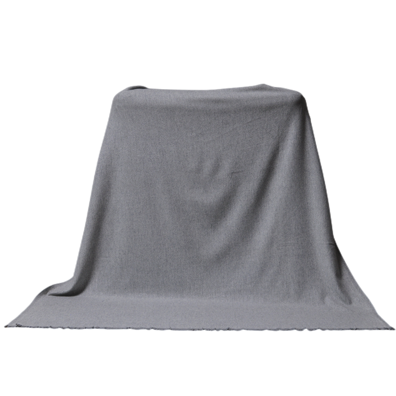 Full display of the light melange grey TH2207 cashmere blanket showing its size and fluid drape.