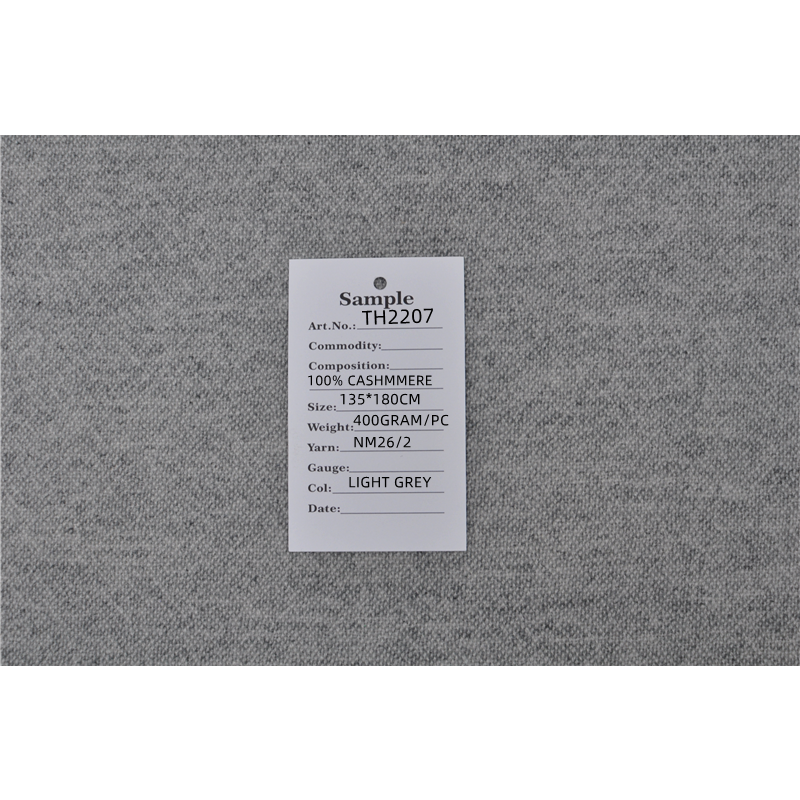TH2207 cashmere blanket sample label showing 100% cashmere, 135 by 180 cm size, 400 gram weight and NM26/2 yarn.