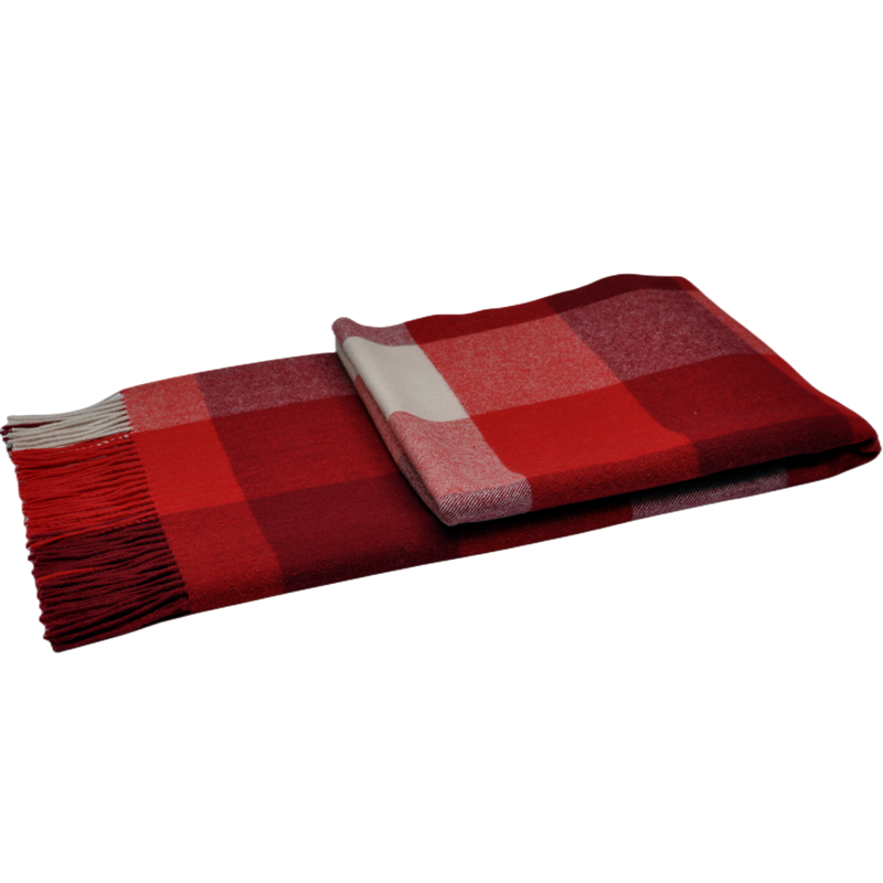 Modern large check wool blanket with fringe detail for home decor.
