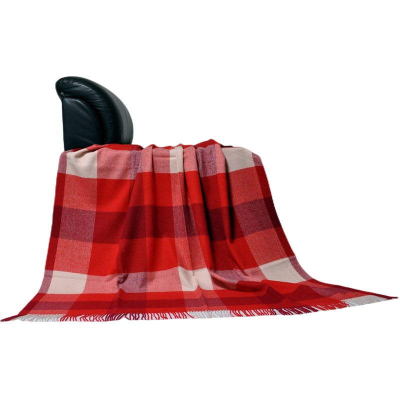 Soft 100% wool checkered blanket styled as a cozy armchair throw.