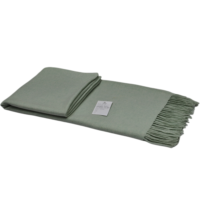 Folded E1108 green melange cashmere wool blanket with product label and fringed edge.