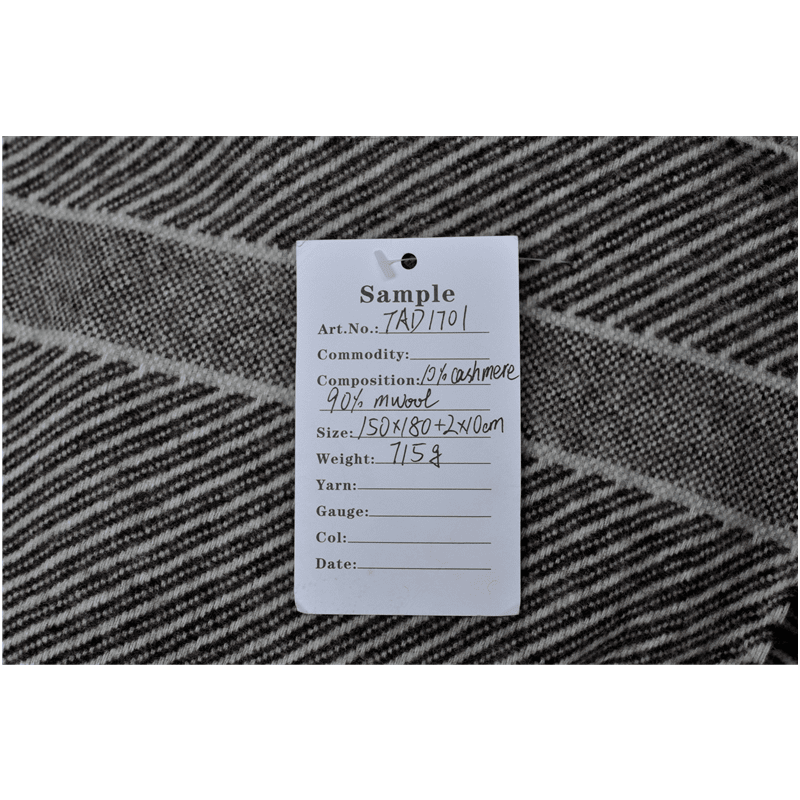 Product specification tag for TAD1701 wool blend blanket, showing composition and size details.