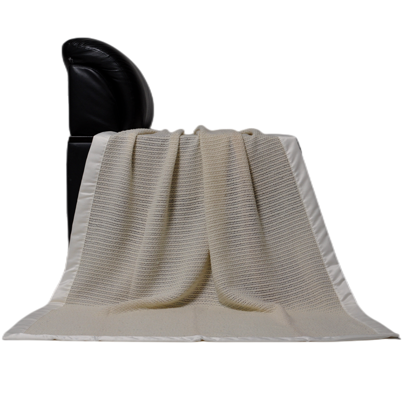 Woven wool blanket displayed vertically showing full size and natural fabric drape