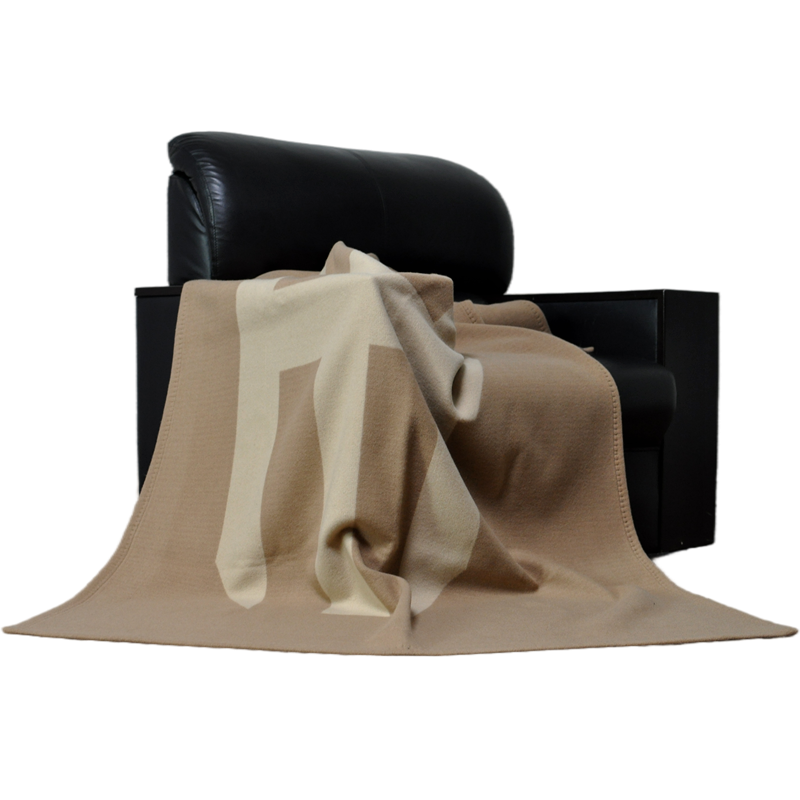 TAK2220 custom logo lamb wool cashmere blanket displayed on chair for corporate gift applications