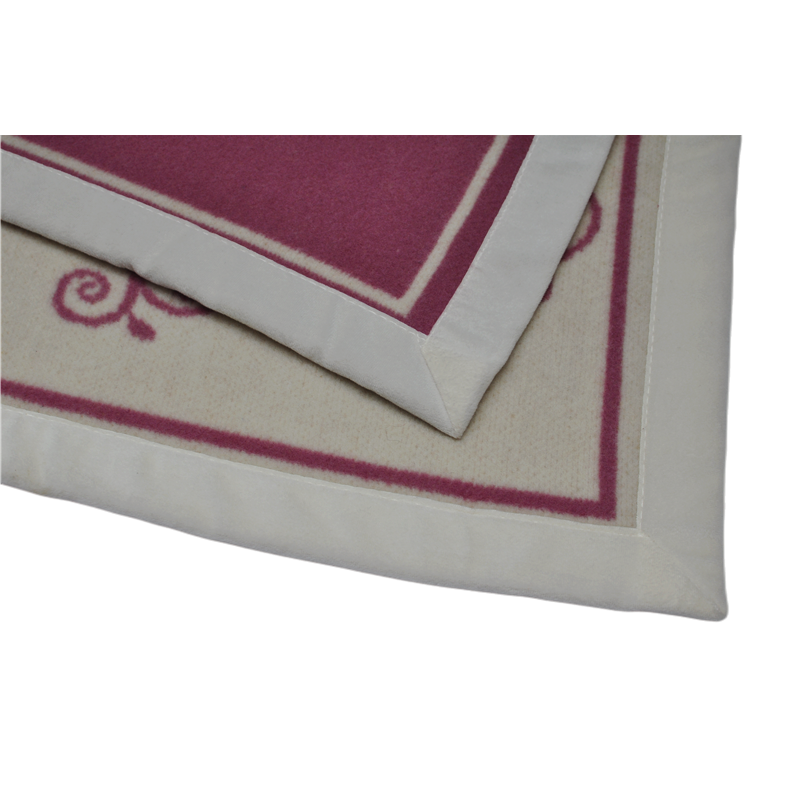 Detail of the neatly folded LL1101 Merino wool jacquard blanket showcasing the Damask pattern.