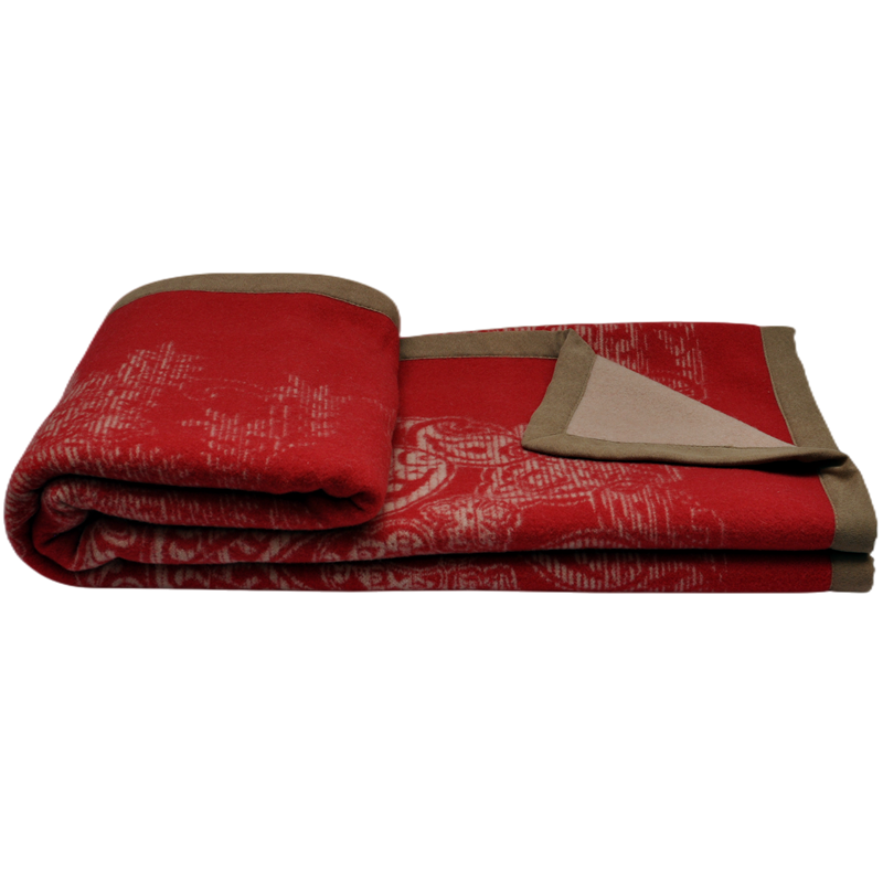 Two-sided red jacquard wool throw blanket folded reverse side view
