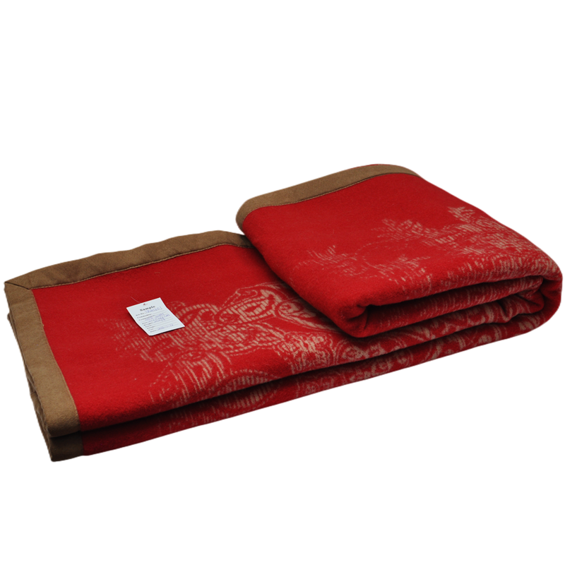 Red paisley wool blanket folded with hang tag flat shot