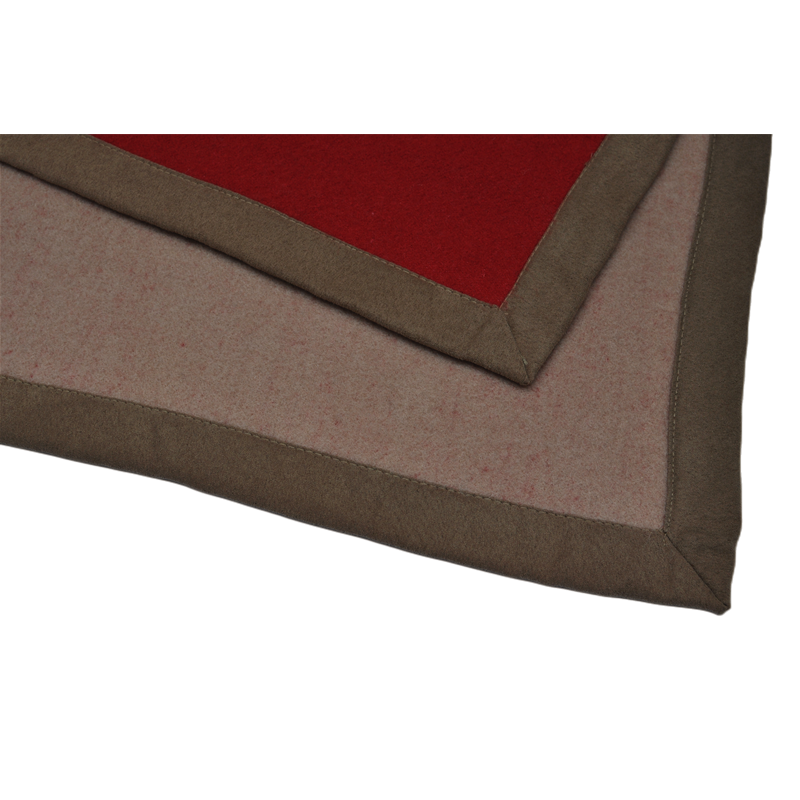 Two-tone reverse side wool blanket brown hem corner close up