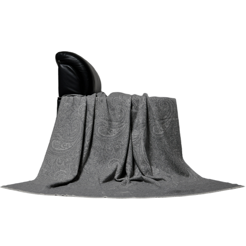 soft lambswool paisley blanket draped on leather chair natural drape texture TH15K0502