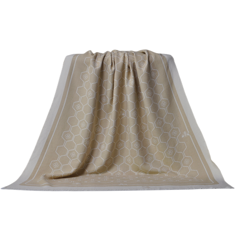 uxury bee themed jacquard wool blanket styled on armchair decor
