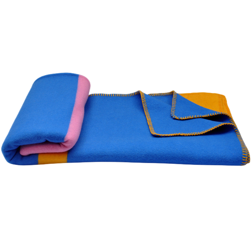 Middle folded three tone wool blanket reverse yellow side zigzag stitching edge white background product photo