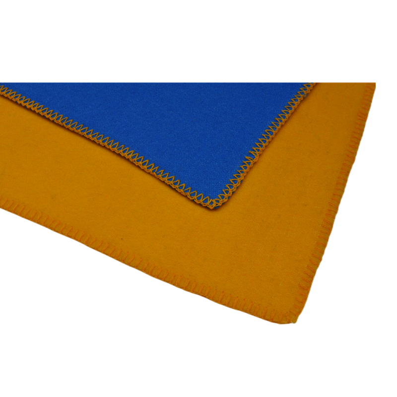 Macro detail shot blanket corner reverse yellow side zigzag stitched hem edge pure wool textile close up
