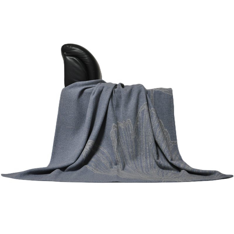 Draped display of TAK2221 pure wool jacquard blanket, textured 3D ginkgo leaf pattern
