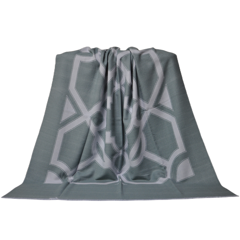 Full frontal view of the TDX2203 grey-green throw blanket highlighting its symmetrical geometric pattern.