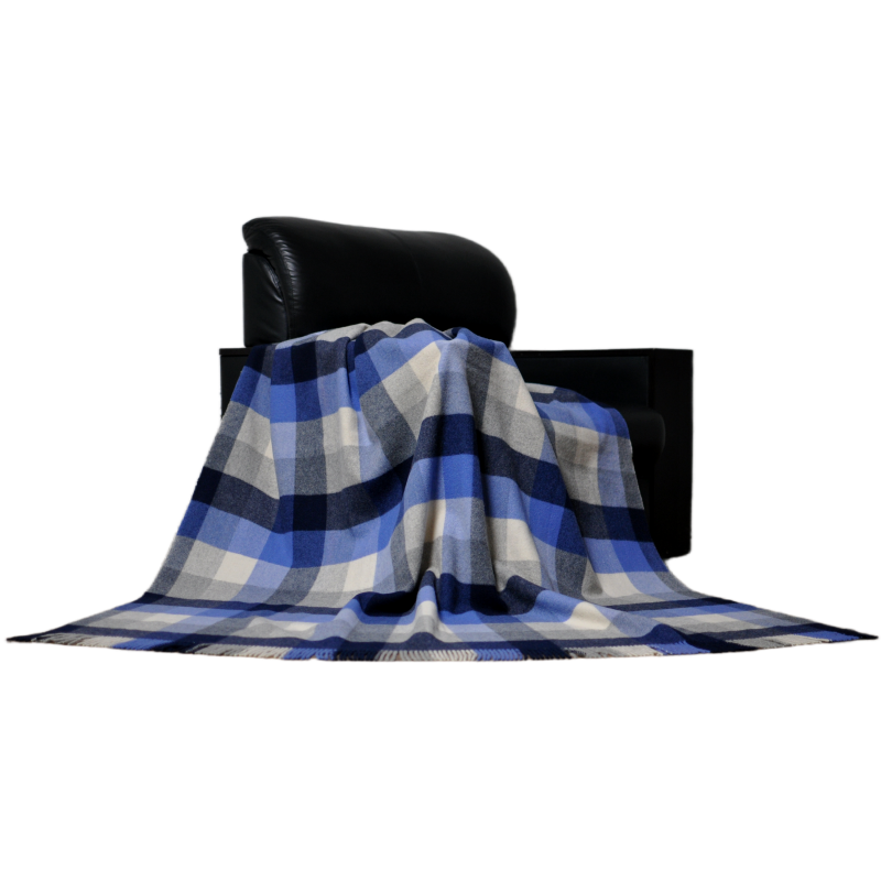 K1003 blue tartan plaid pure wool blanket styled elegantly as a decorative throw on a modern living room sofa