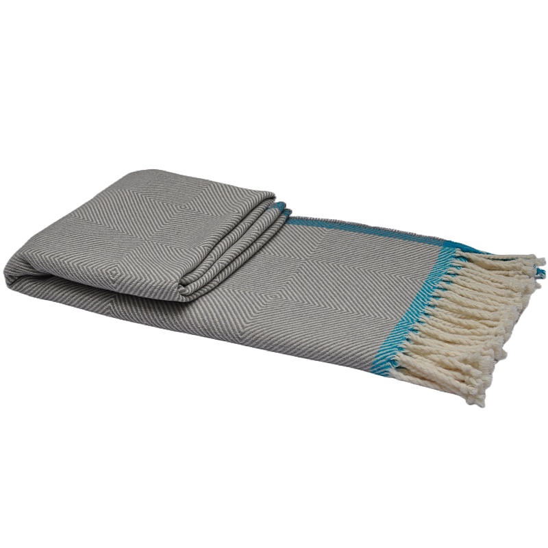 Folded luxury wool herringbone nested chevron throw blanket with white tassels