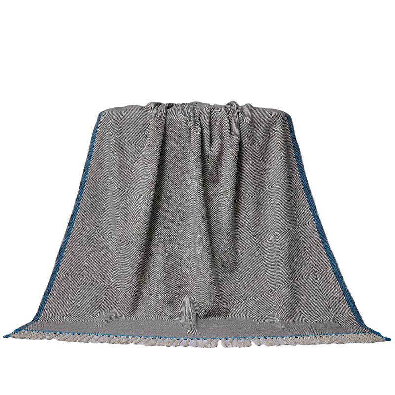 Elegant grey herringbone wool blanket showing full texture and tassel design