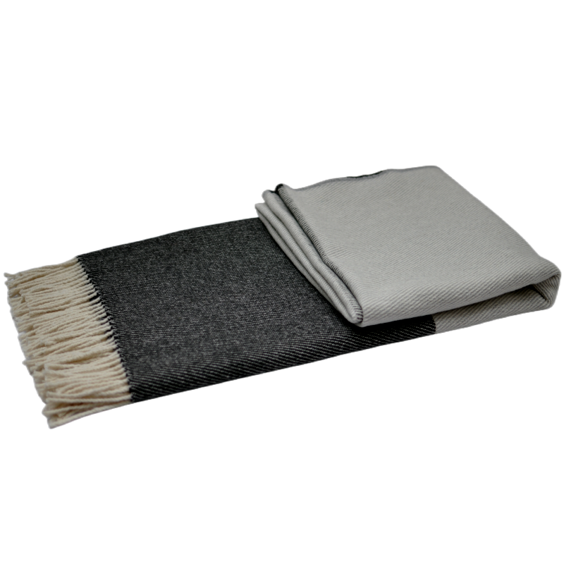 Reverse folded grey block fringed wool throw blanket flat lay