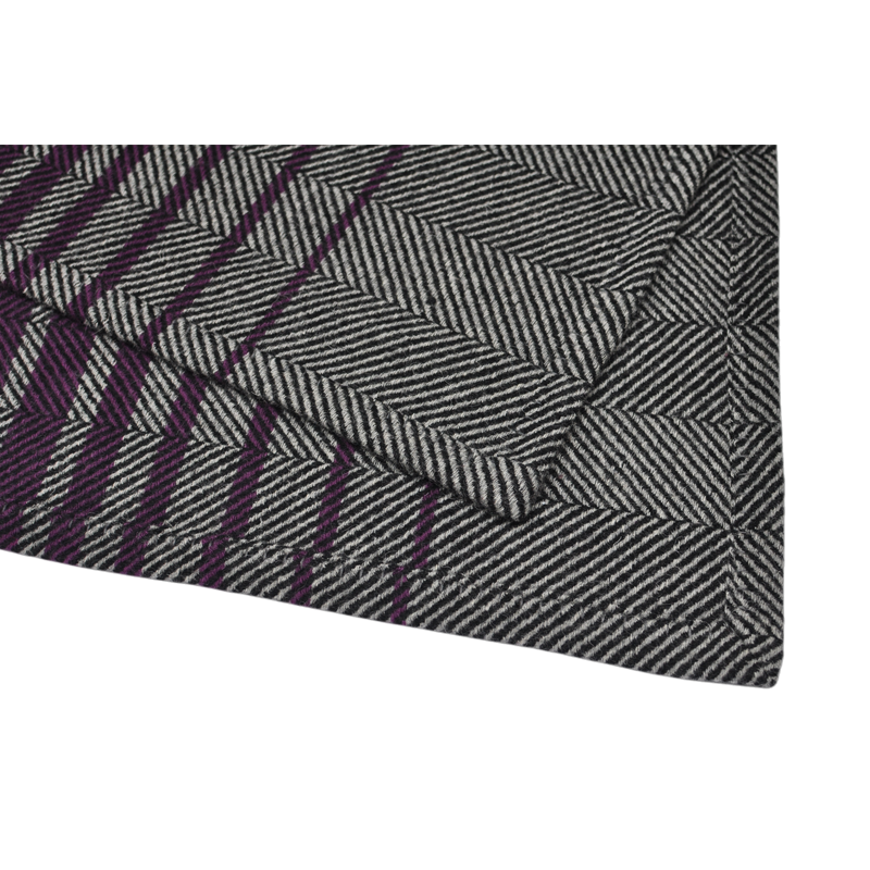 Close-up-of-blue-phoenix-TAK2209-textile-label-on-khaki-purple-wool