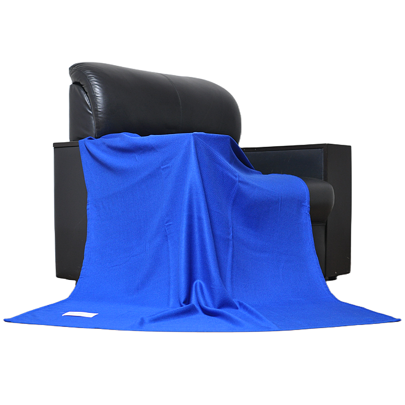 Modacrylic aviation throw blanket draped on leather armchair