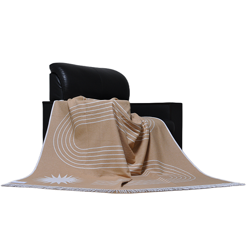 Luxury mélange camel and white organic cotton throw draped elegantly on black chair TDX2135