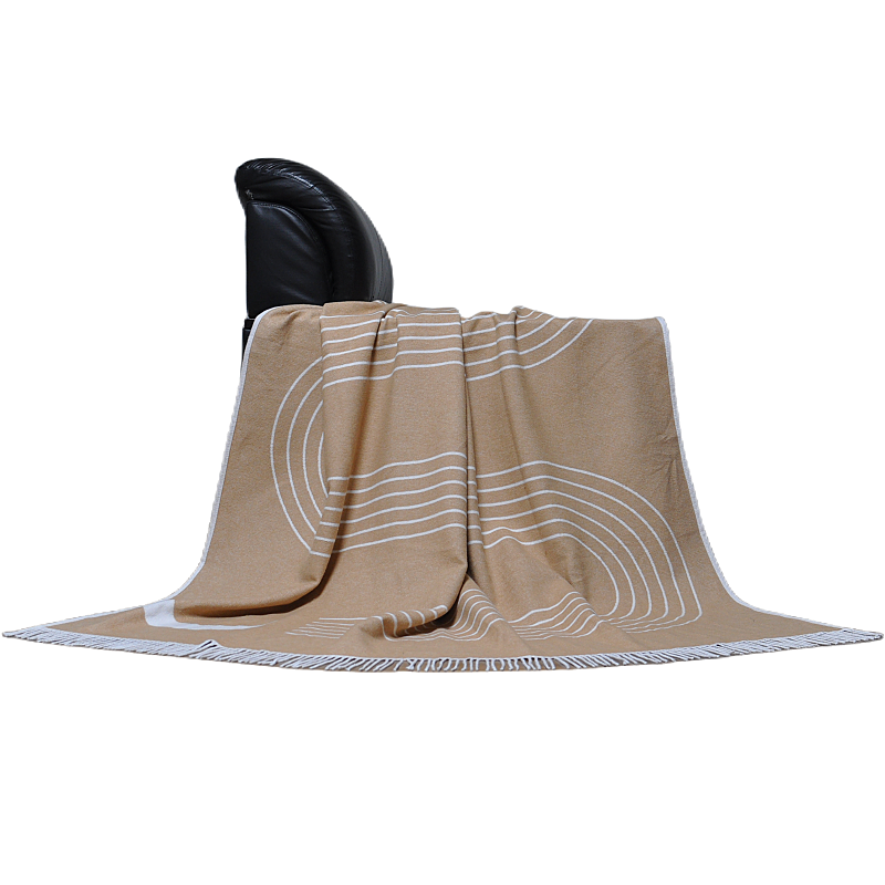 mélange camel and white organic cotton throw draped on chair