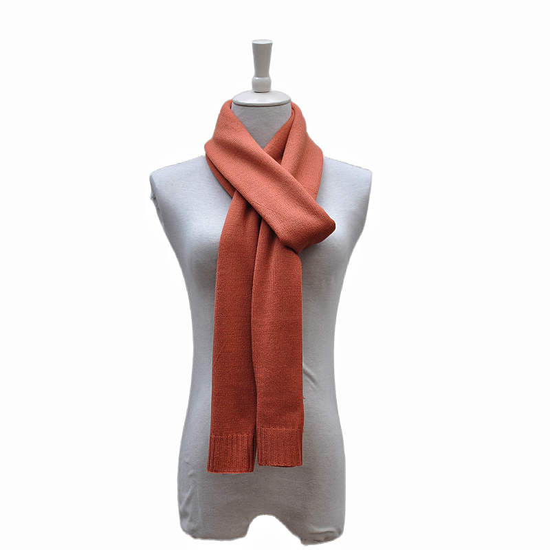 Rust orange TH2309 wool blend knitted shawl styled on mannequin with classic knot