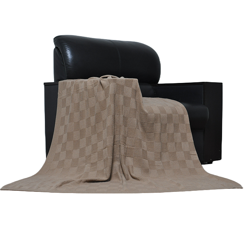 TH15A0901 100% cashmere throw blanket draped over black leather sofa, lifestyle shot