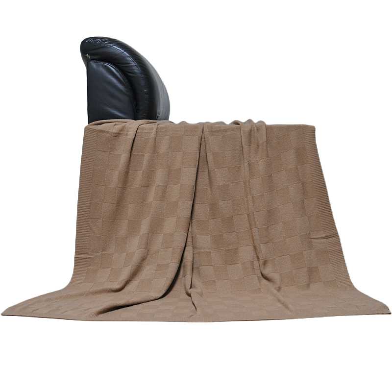 Blue Phoenix TH15A0901 cashmere blanket styled on sofa, showing full drape and checkered knit pattern