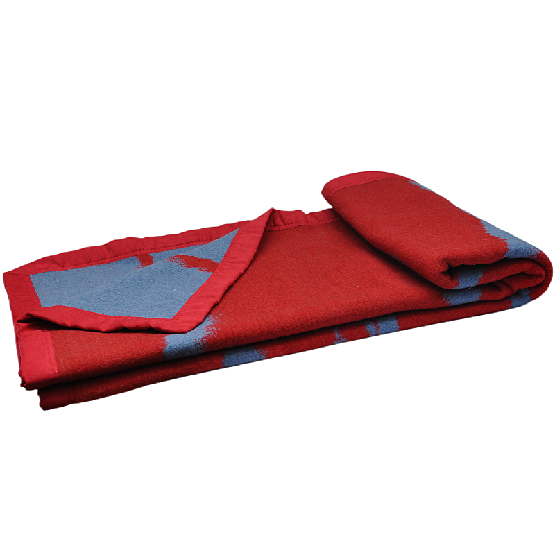 Angled view of the folded red and grey wool throw blanket, highlighting the suede-bound edge.
