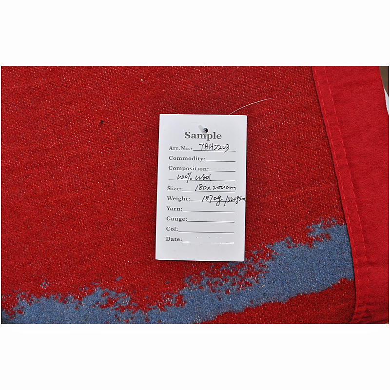Product sample tag on a wool blanket detailing TBH2203 specifications.