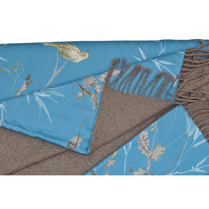 Throw blanket corner closeup silk print surface & brown yak down lining tassel