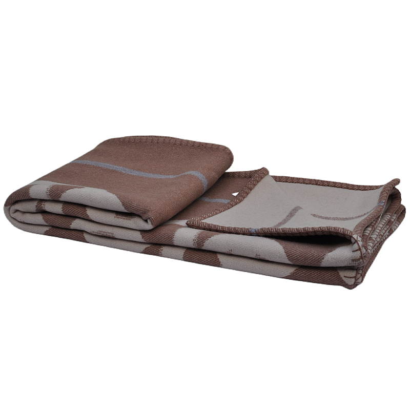 TAK2260 folded 100% lambswool reversible jacquard blanket showing camel-brown and ivory sides