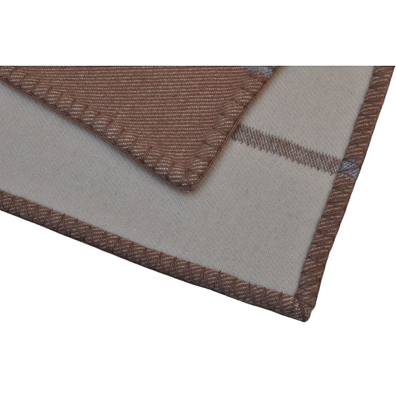 TAK2260 reversible wool blanket corner showing the ivory reverse and decorative brown stitched edge