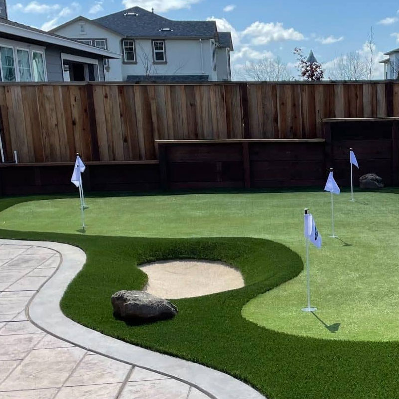 What are the common materials used for outdoor putting greens? Doleader